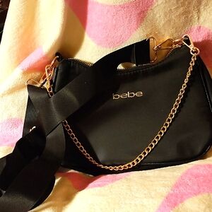 Medium size purse with cloth strap or chain link strap. Take your pick. Also poc